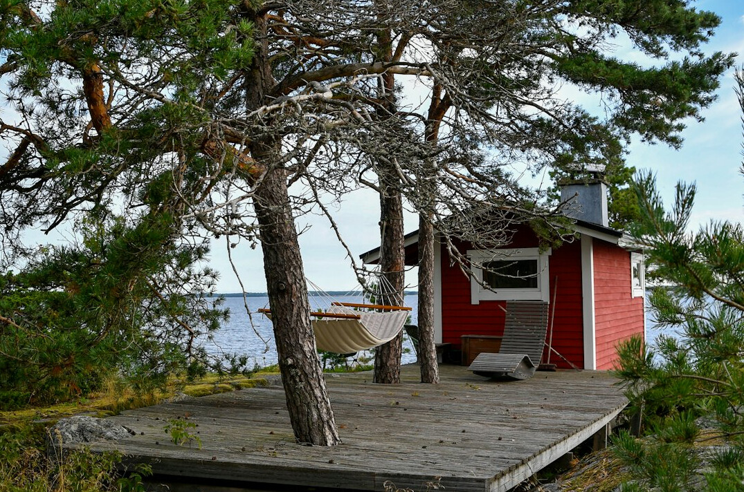 old fisherman in wooden cottage